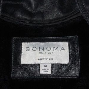 Black leather and fur lined jacket.  Size M.